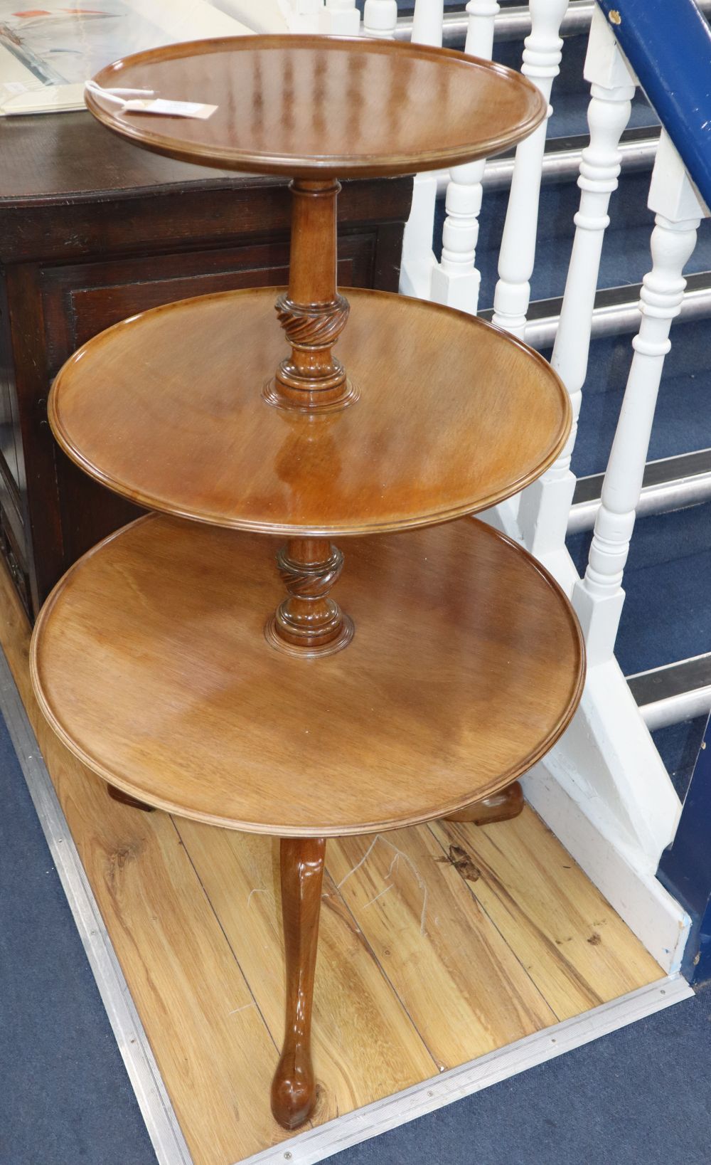 A George III style mahogany three tier dumb waiter, H.100cm